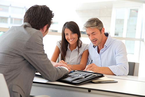 Couple discussing with the loan consultant